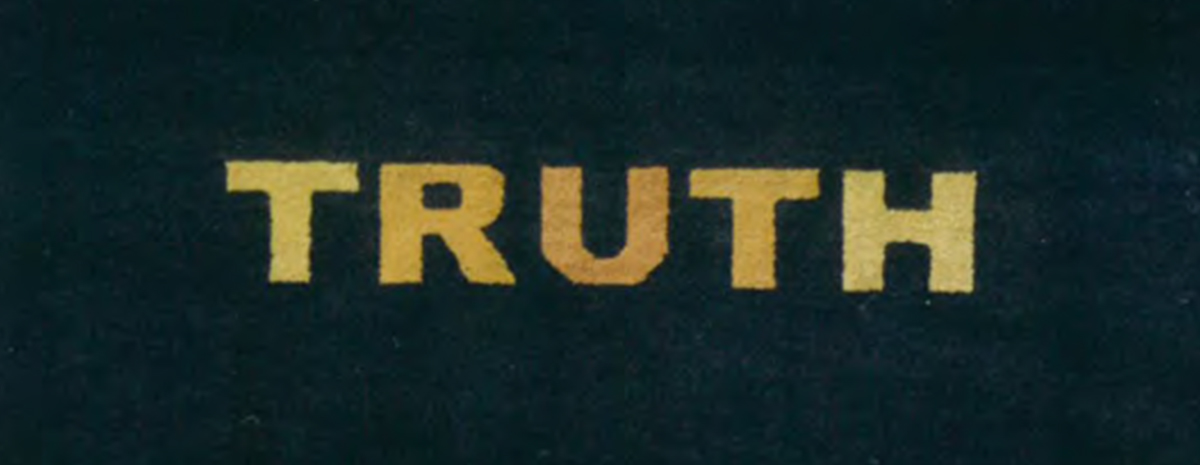 The word truth in amber letters against a black backdrop.